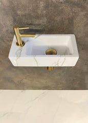 Rhea S mini vanity set with left-hand carrara basin, tap, siphon and brushed brass drain plug