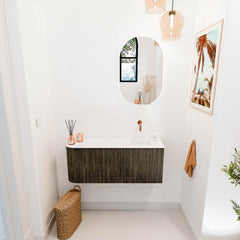 JOYA 101,6cm toiletmeubel ronding links kleur Shadow. Wastafel FAYE positie Rechts Zonder kraangat kleur Talc.