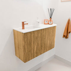 JOYA 71,6cm toiletmeubel ronding rechts kleur Oak. Wastafel FAYE positie Links 1 kraangat kleur Talc.