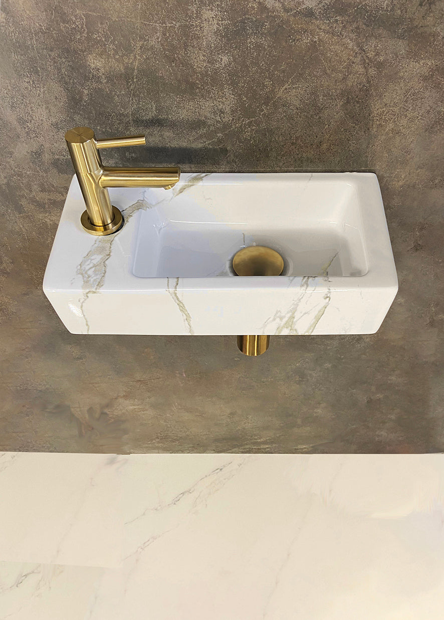Rhea S mini vanity set with left-hand carrara basin, tap, siphon and brushed brass drain plug