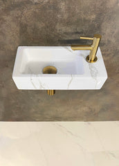 Rhea S mini vanity set with right-hand carrara basin, tap, siphon, and brushed brass drain plug